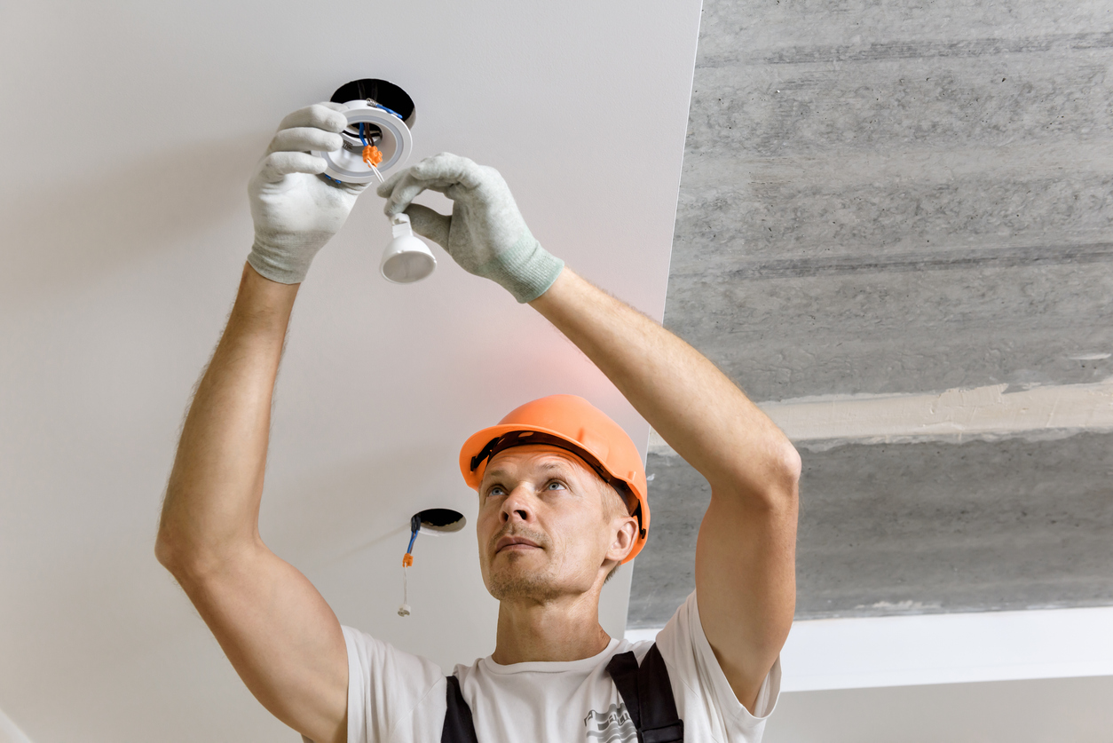 Electrician installing LED