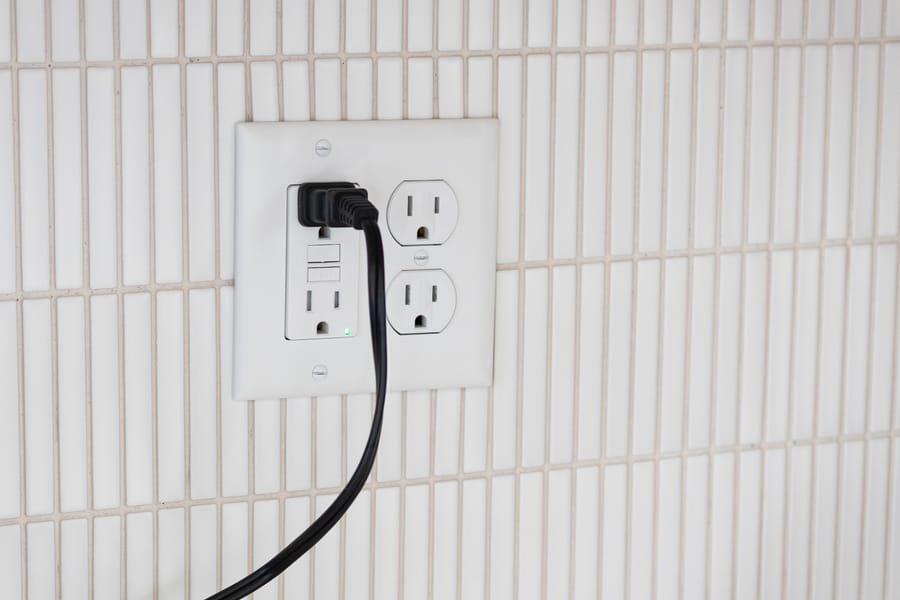 Power cord plugged into a GFCI electrical outlet